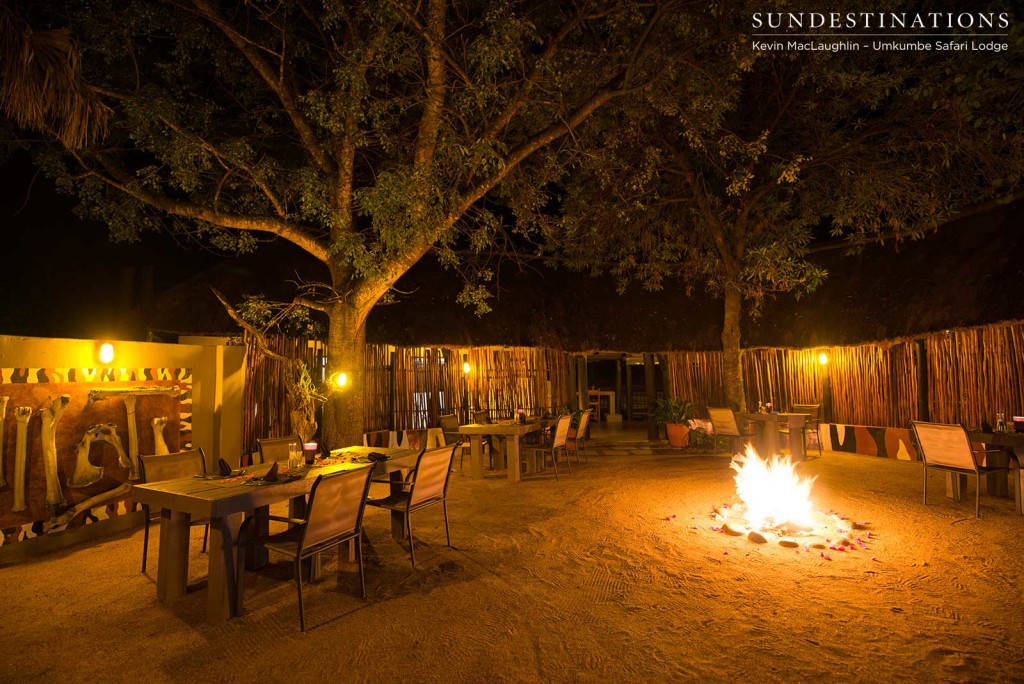 The fire crackles away in the centre of the boma as the Umkumbe guests arrive back from game drive
