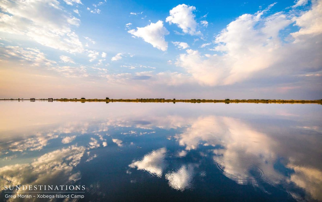 The Okavango Delta skies reflected perfectly in the lake of water below
