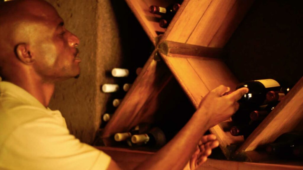 Aubrey selecting a bottle of wine Aubrey selecting a bottle of wine