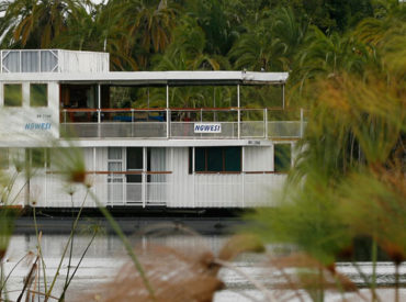 An opportunity to investigate the Delta from a new perspective – the Ngwesi Houseboat glides in between reed beds of the unexplored Okavango.