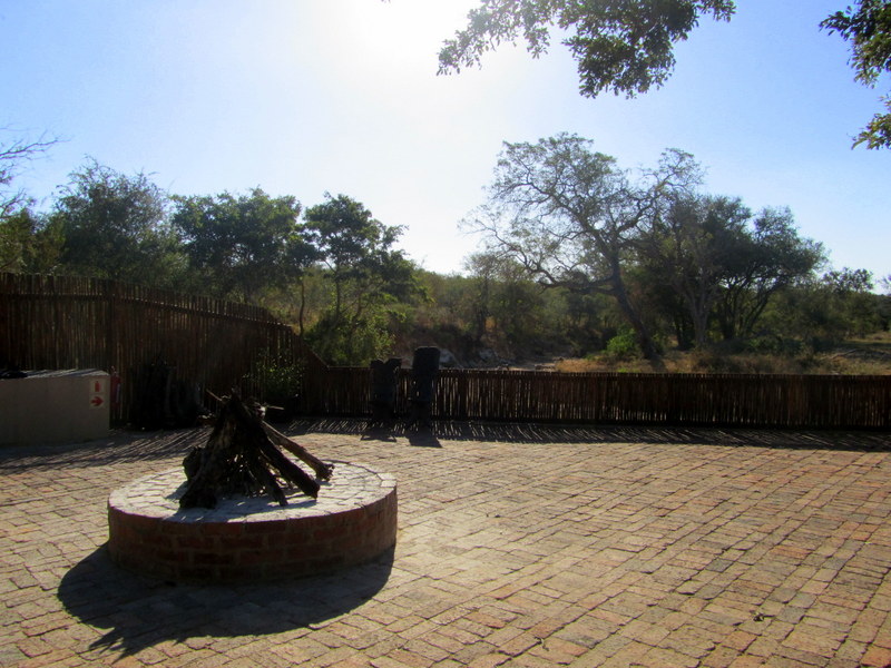 The firepit (always flaming at night) overlooking the waterhole. 