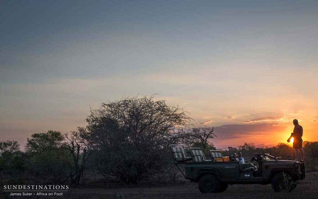 Photographer and filmmaker, Kevin MacLaughlin, in the sunset at Africa on Foot