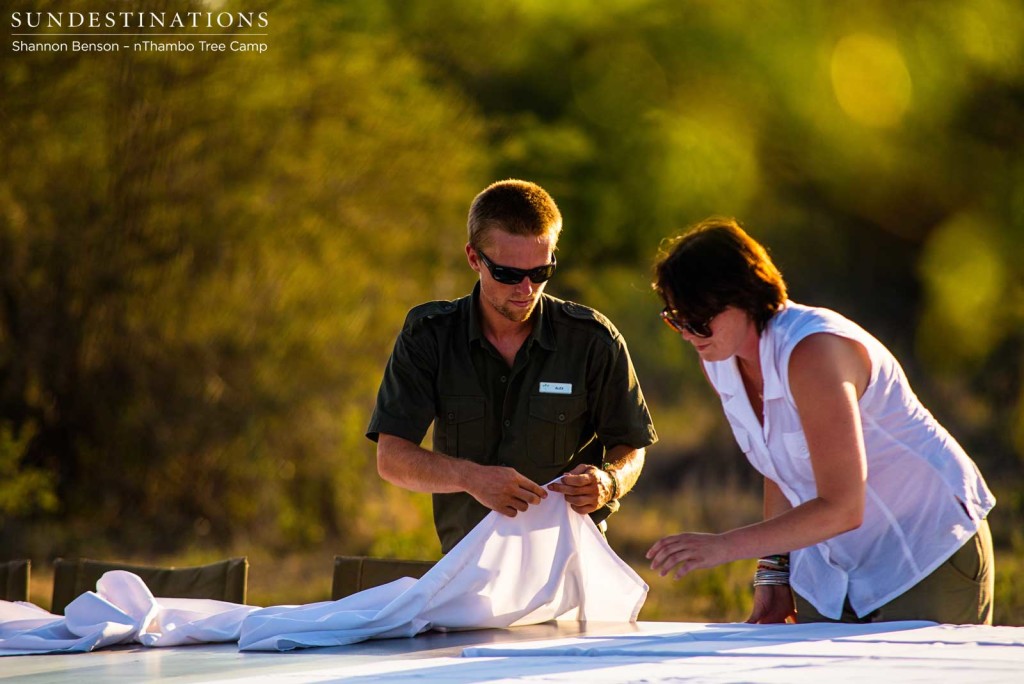 Nadia and Alex laying the tablecloth