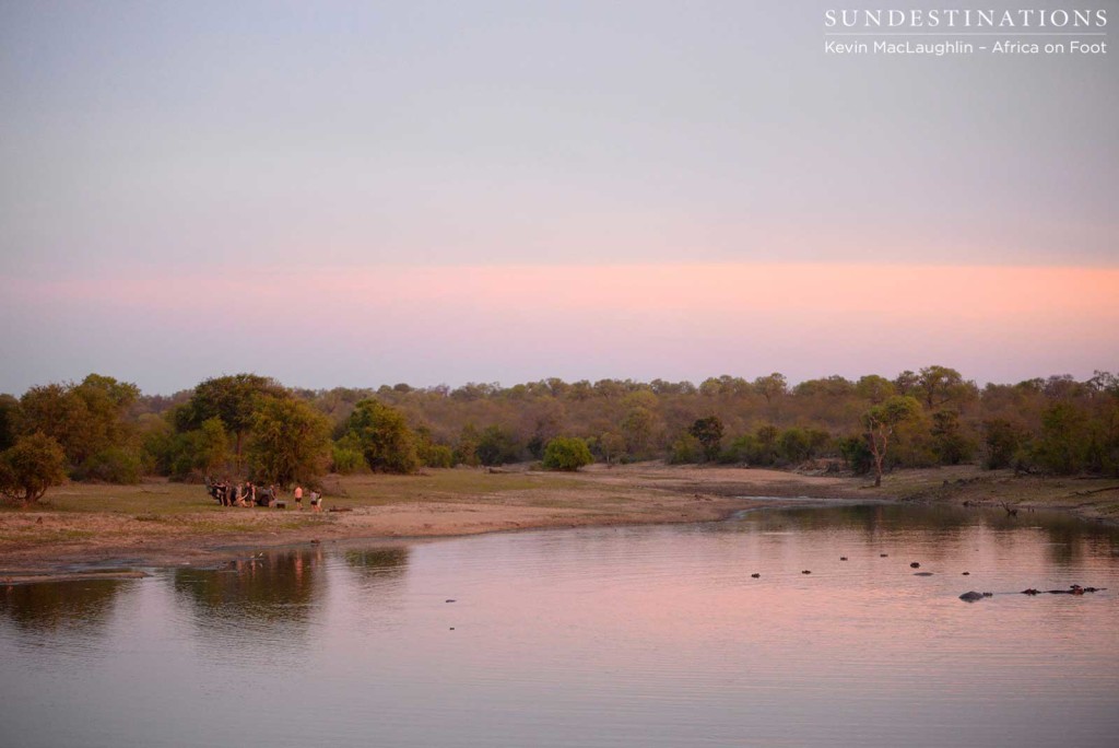 Africa on Foot guests enjoying the sunset on the dam