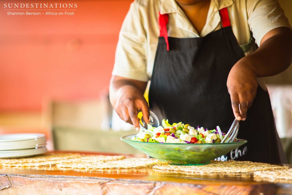 Natasha tossing a salad