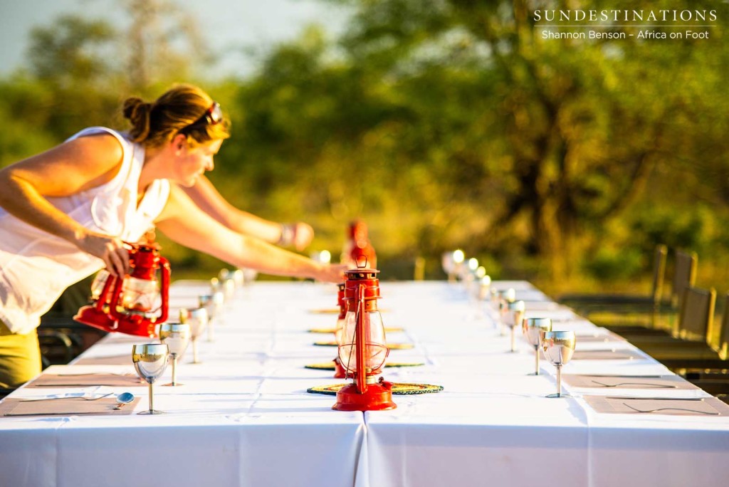 Jen preparing a table for a bush dinner