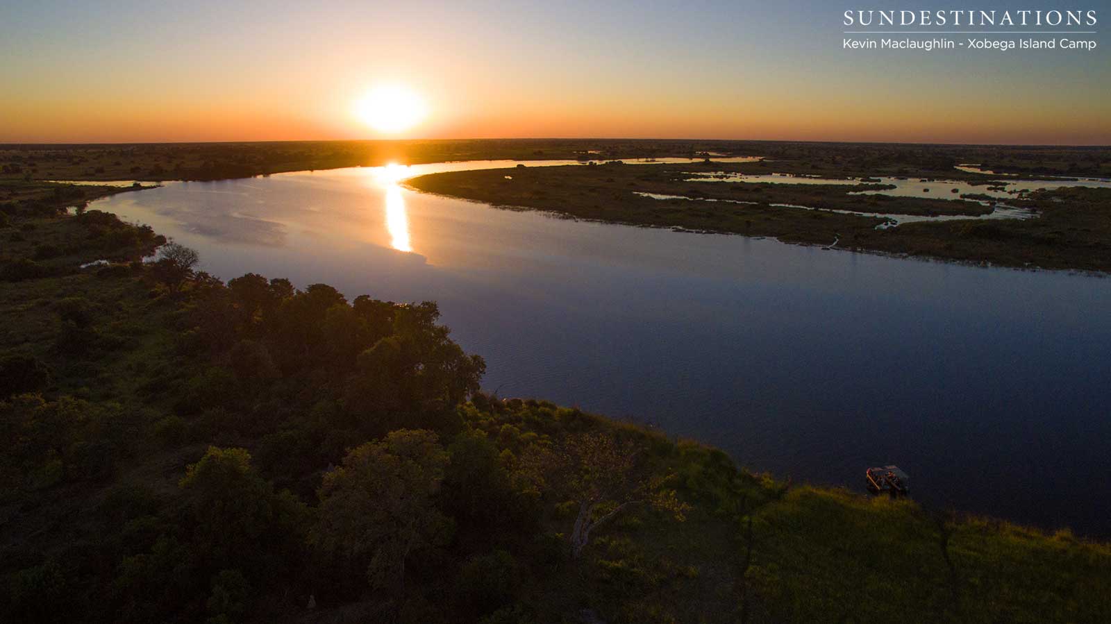 Sunset in the Okavango Delta with Xobega Island Camp boat cruise